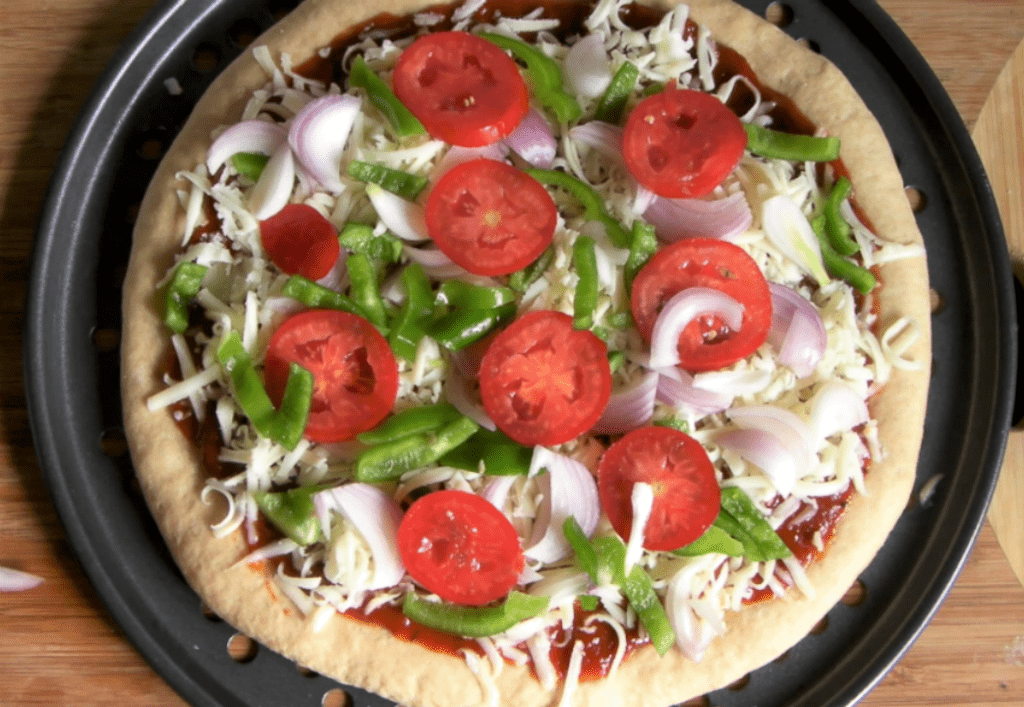 Whole wheat veggie pizza made with yeast from scratch