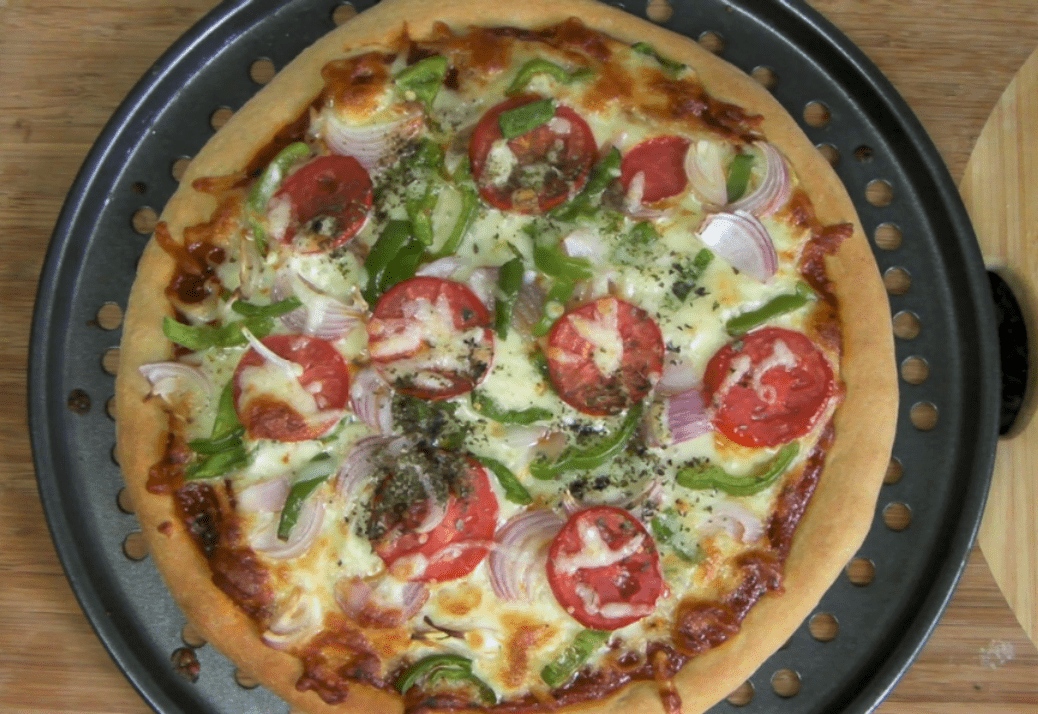 Whole wheat veggie pizza made with yeast from scratch