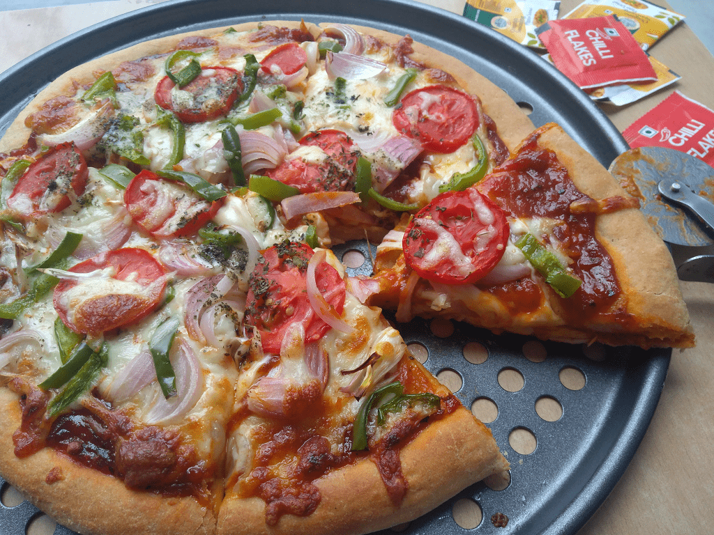 Whole wheat veggie pizza made with yeast from scratch