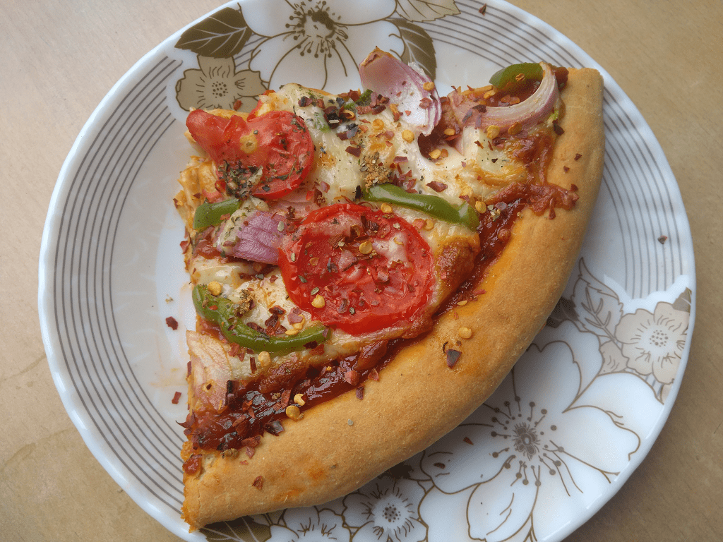 Whole wheat veggie pizza made with yeast from scratch