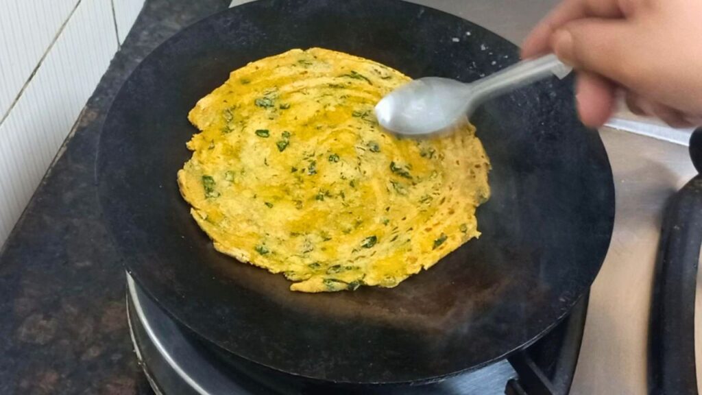 cooking part of moringa leaves paratha 1 Healthically Kitchen